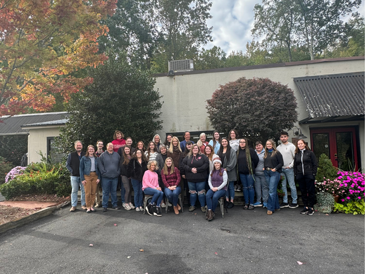 Our Farm House team in front of our Landrum HQ stores\